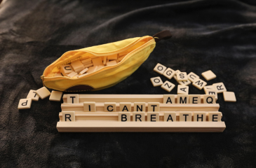 Bag of letters with a tray spelling out "I Can't Breathe"