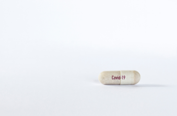 Capsule with "COVID-19" written on it