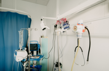 Corner of a hospital room with a ventilator, stethoscope, and other medical devices